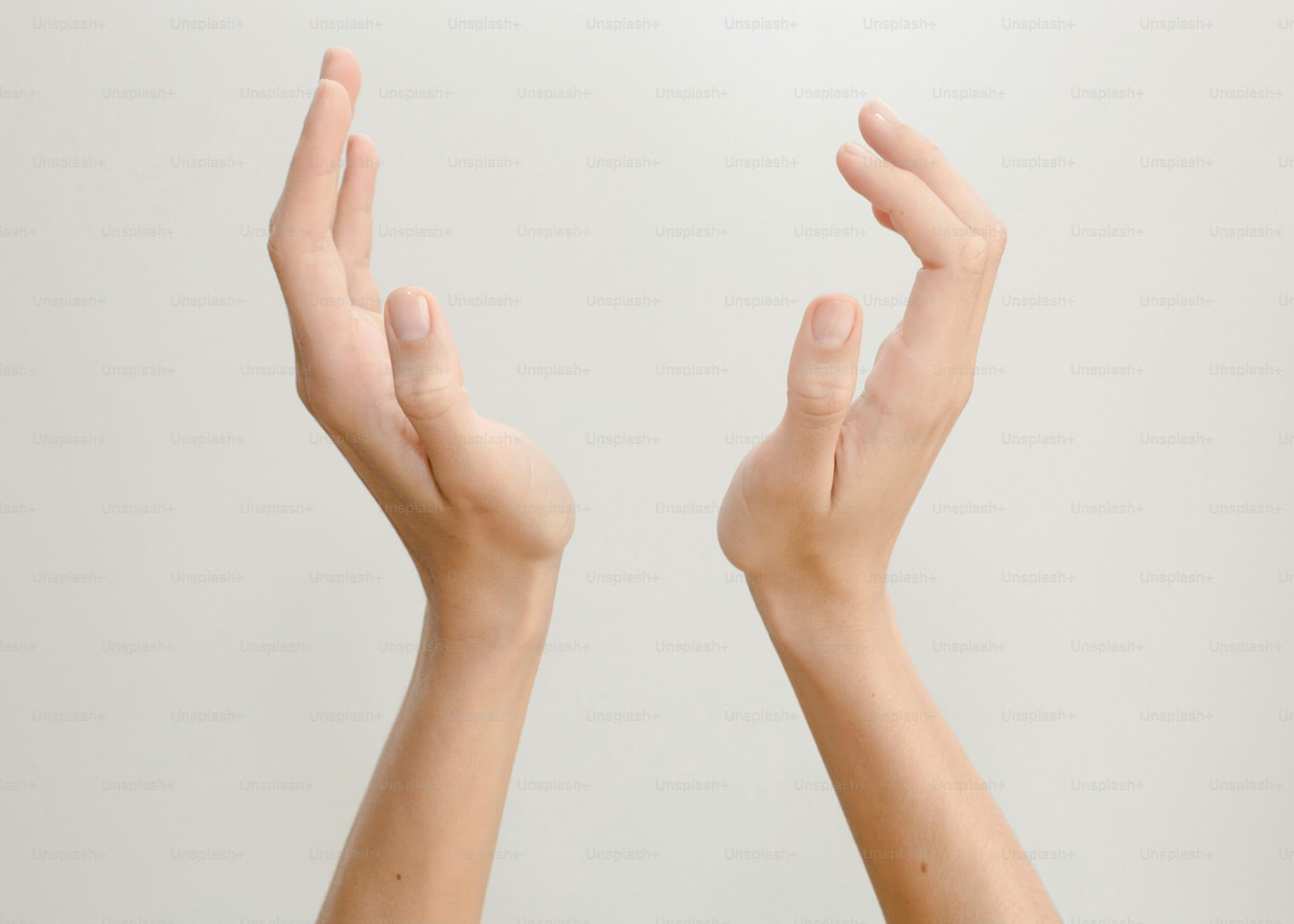 Hands cupped together in the light